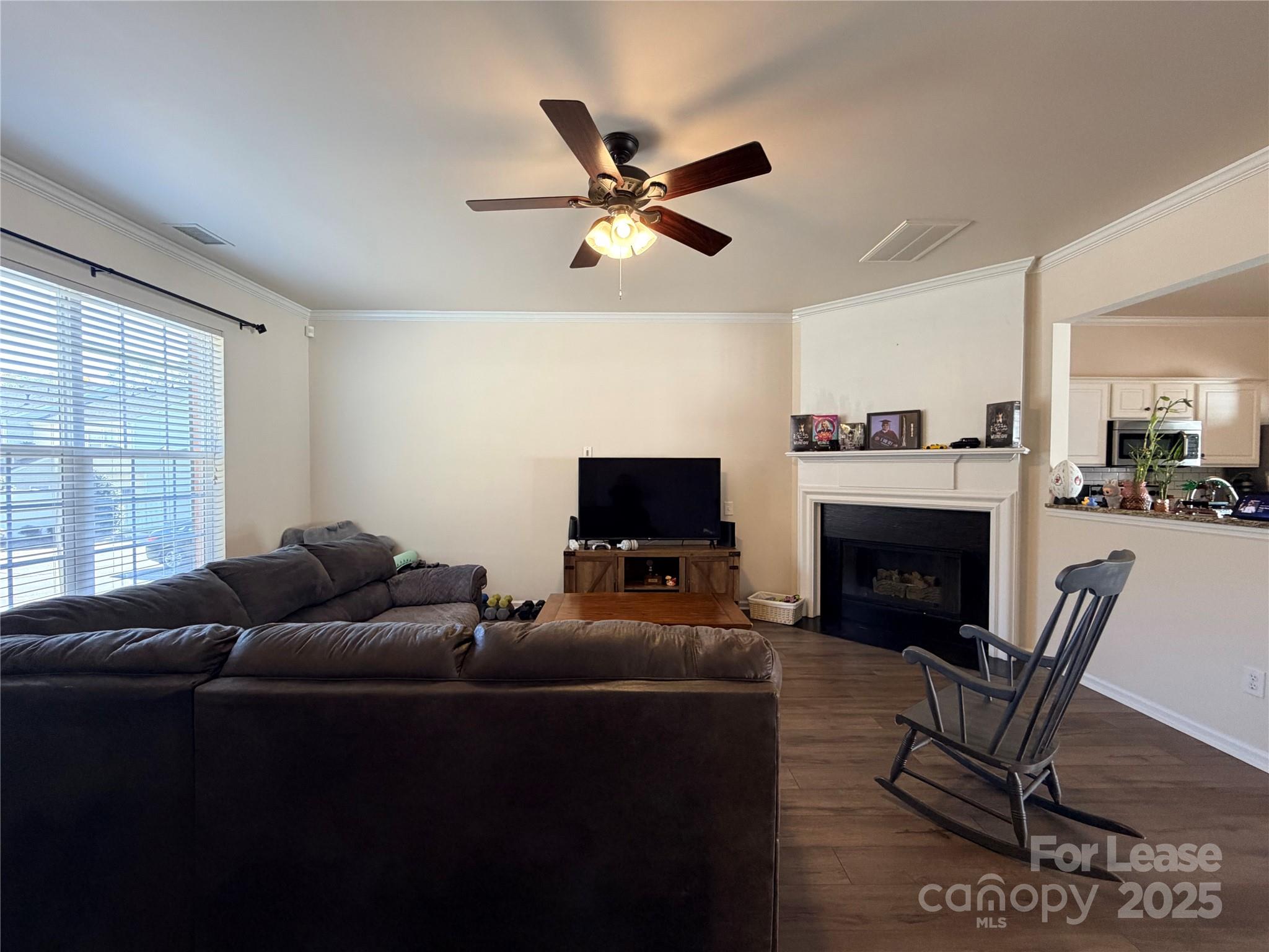 6836 Rothchild Drive Charlotte, NC 28270 - Photo 7 of 25 a living room with furniture a fireplace and a large window