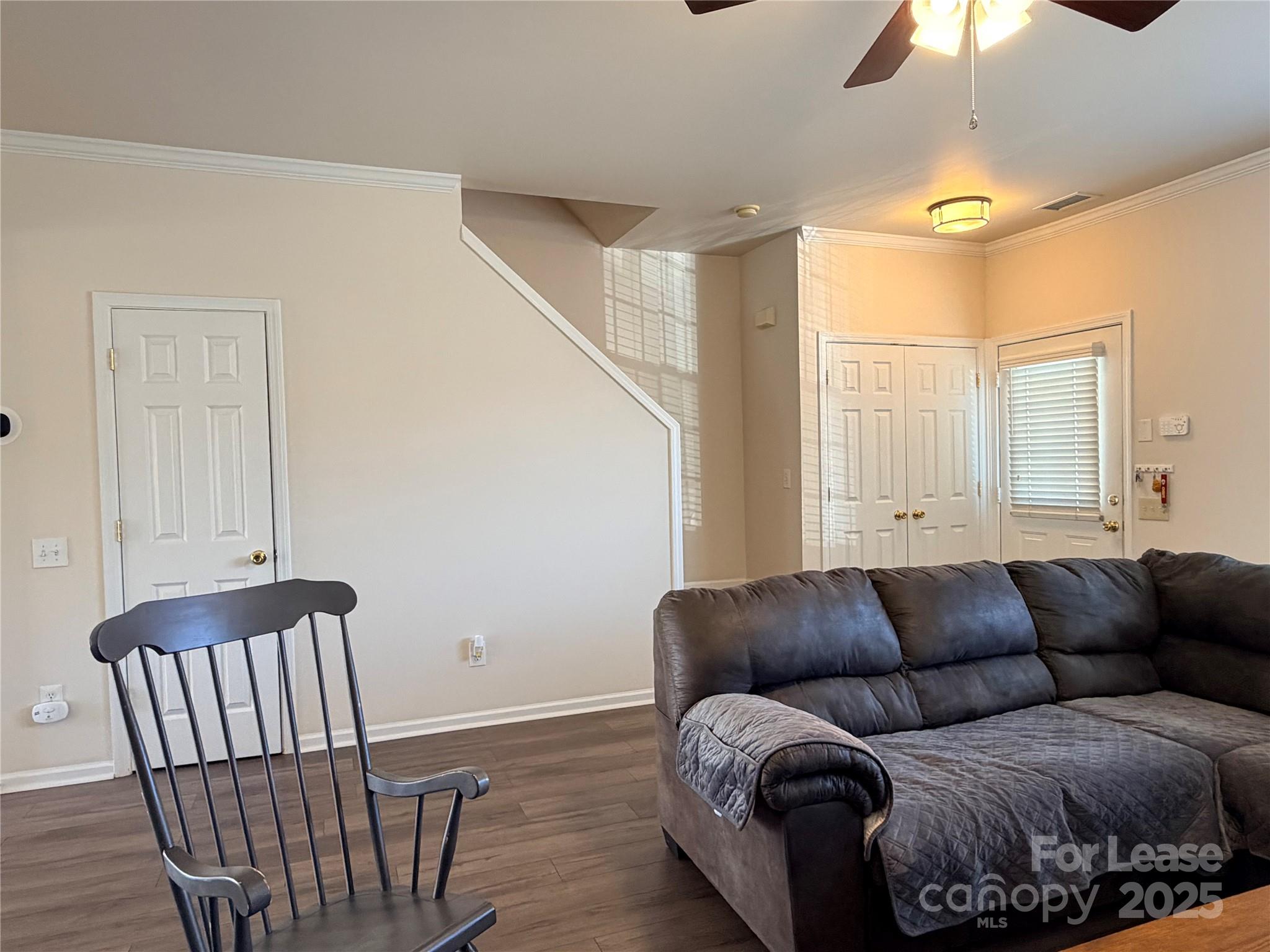 6836 Rothchild Drive Charlotte, NC 28270 - Photo 10 of 25 a living room with furniture and a chandelier