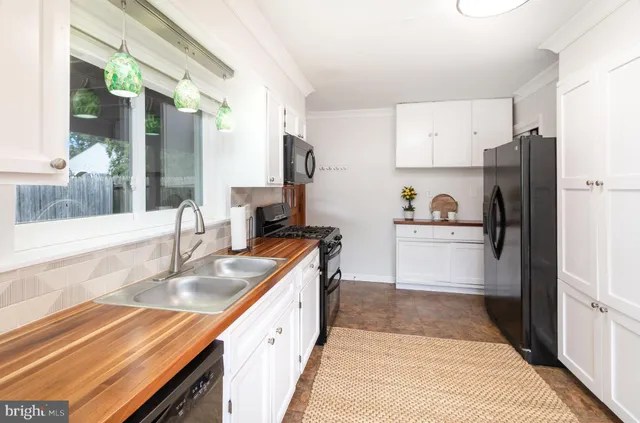 a bathroom with a toilet sink and vanity