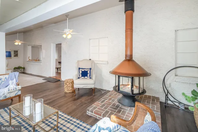a view of a dining room with furniture and a chandelier