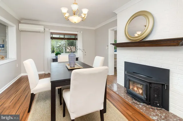 a view of a kitchen filled with furniture and windows