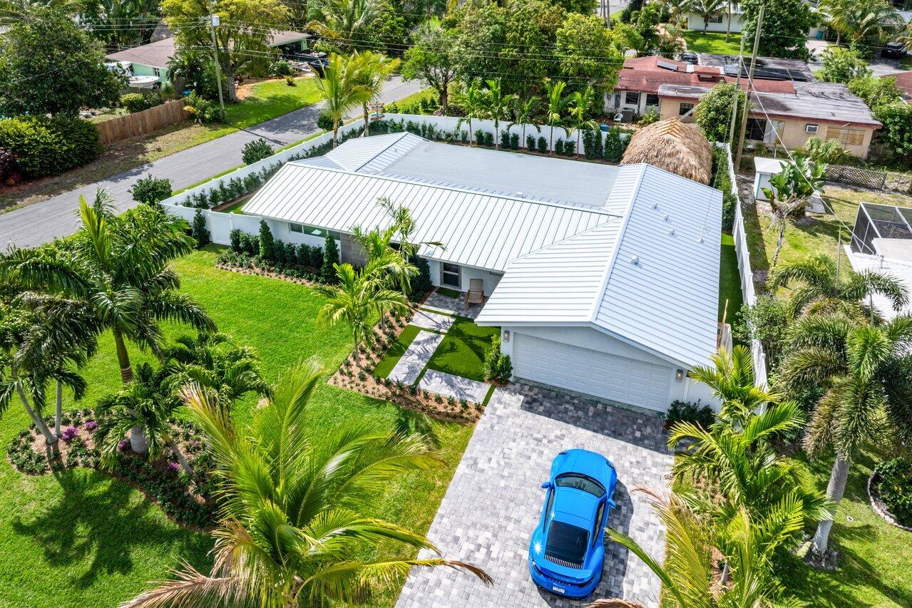 902 Southwest 27th Place Boynton Beach, FL 33435 - Photo 44 of 52 an aerial view of a house with a garden and plants