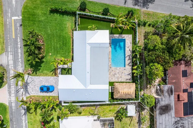 an aerial view of residential houses with outdoor space