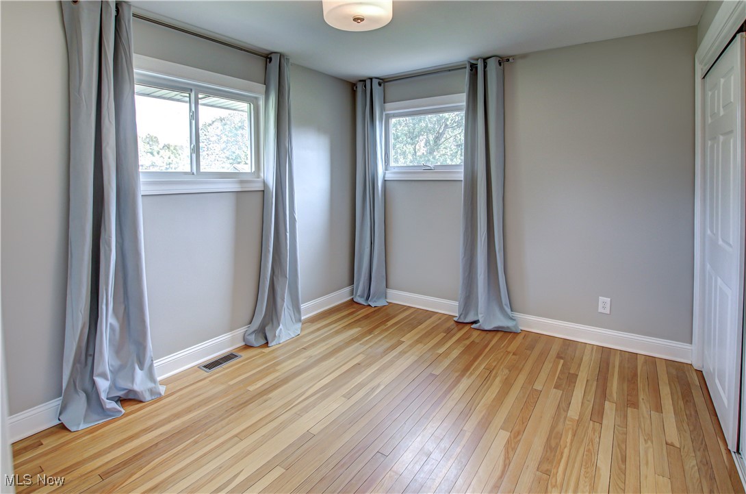 12477 Webster Road Strongsville, OH 44136 - Photo 24 of 40 Spare room with light hardwood / wood-style flooring and a healthy amount of sunlight