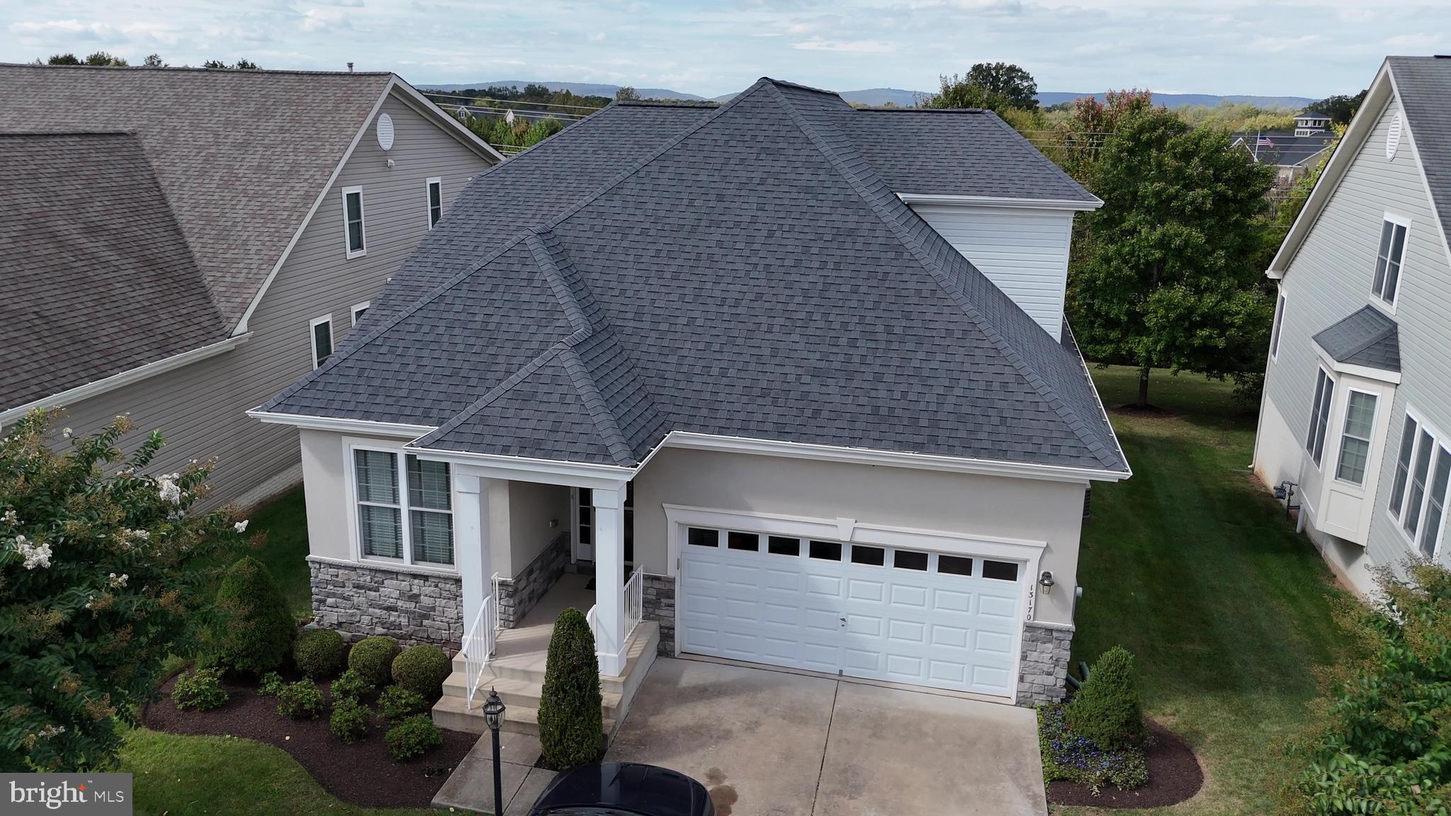 13170 Triple Crown Loop Gainesville, VA 20155 - Photo 71 of 71 a aerial view of a house with a yard and potted plants