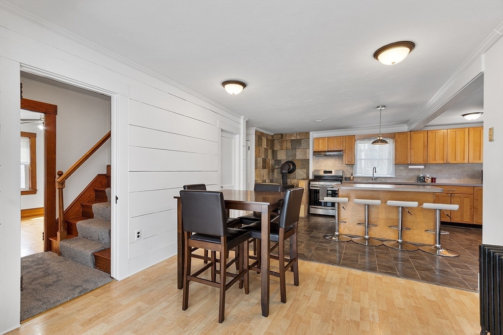 48 Mill Street Maynard, MA 01754 - Photo 12 of 31 a view of a dining room with furniture and a rug