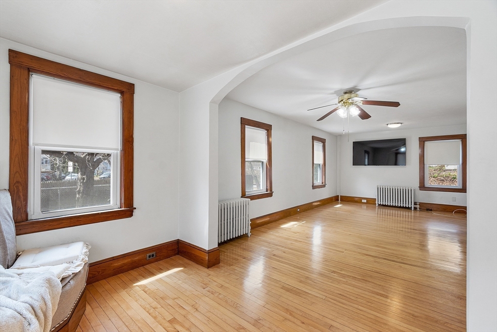 48 Mill Street Maynard, MA 01754 - Photo 16 of 31 a view of a bedroom with wooden floor and window