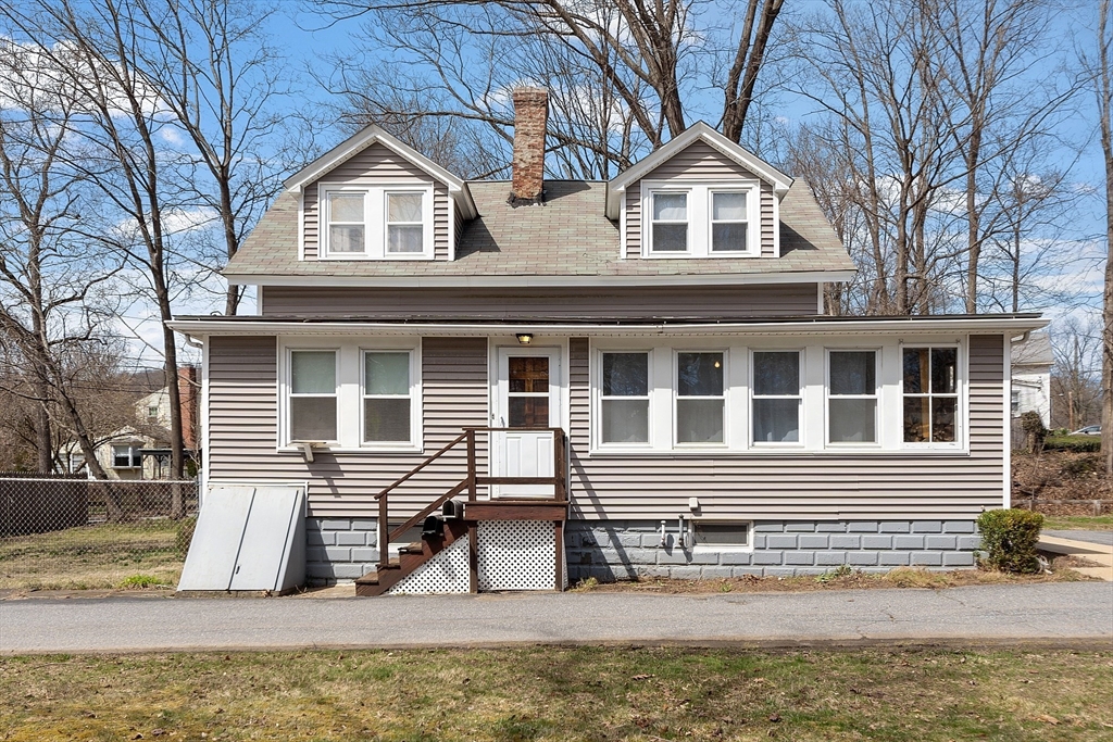 48 Mill Street Maynard, MA 01754 - Photo 2 of 31 a front view of a house with a yard