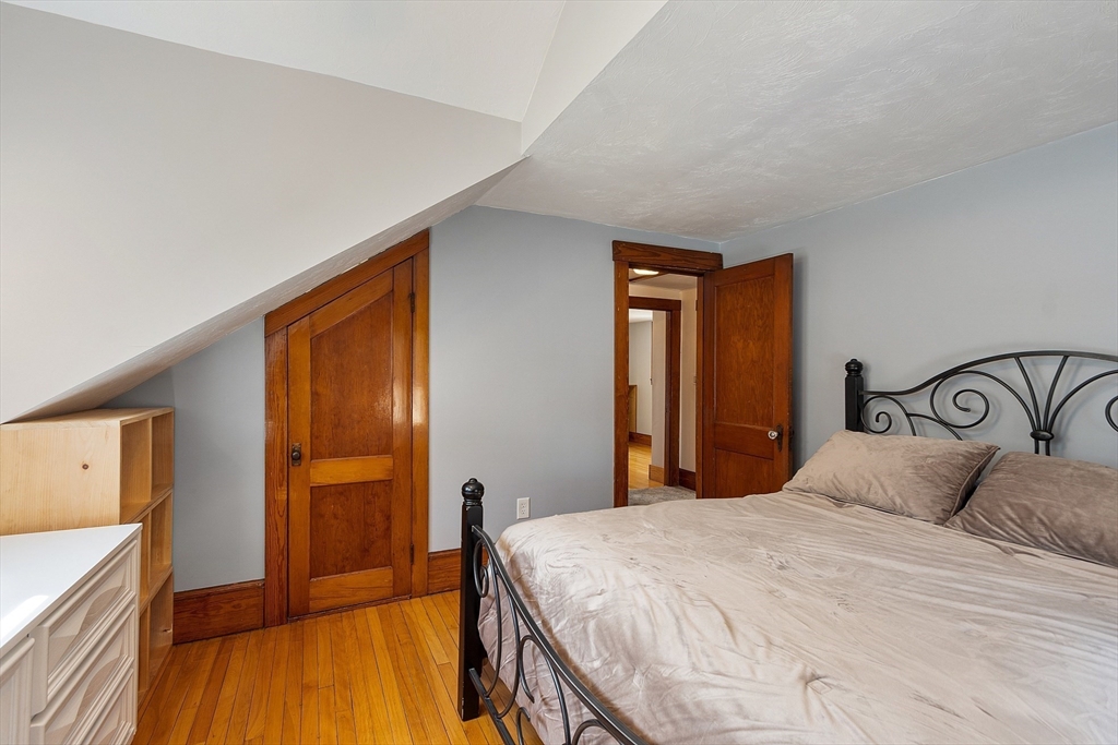 48 Mill Street Maynard, MA 01754 - Photo 24 of 31 a bedroom with a bed and a dresser