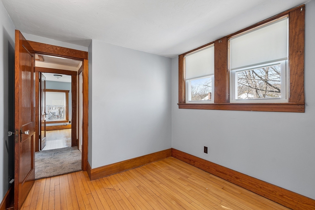 48 Mill Street Maynard, MA 01754 - Photo 26 of 31 a view of empty room with wooden floor and fan