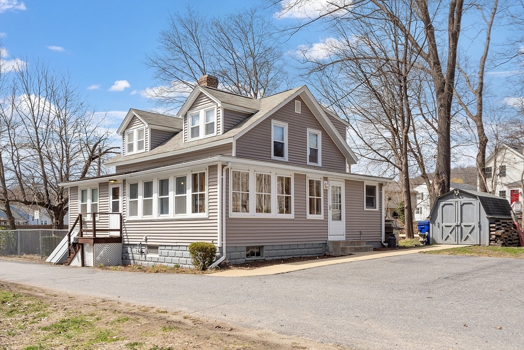 48 Mill Street Maynard, MA 01754 - Photo 28 of 31 a view of a house with a yard covered in snow
