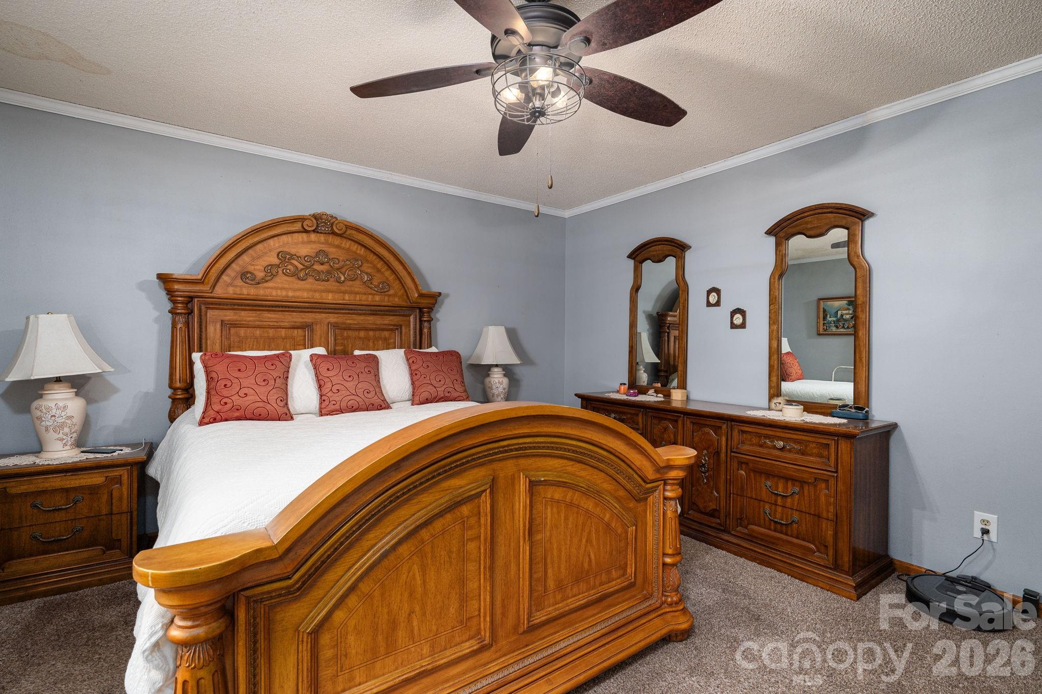 3815 Wildcherry Road Shelby, NC 28150 - Photo 16 of 33 a bedroom with a bed and dresser with mirror