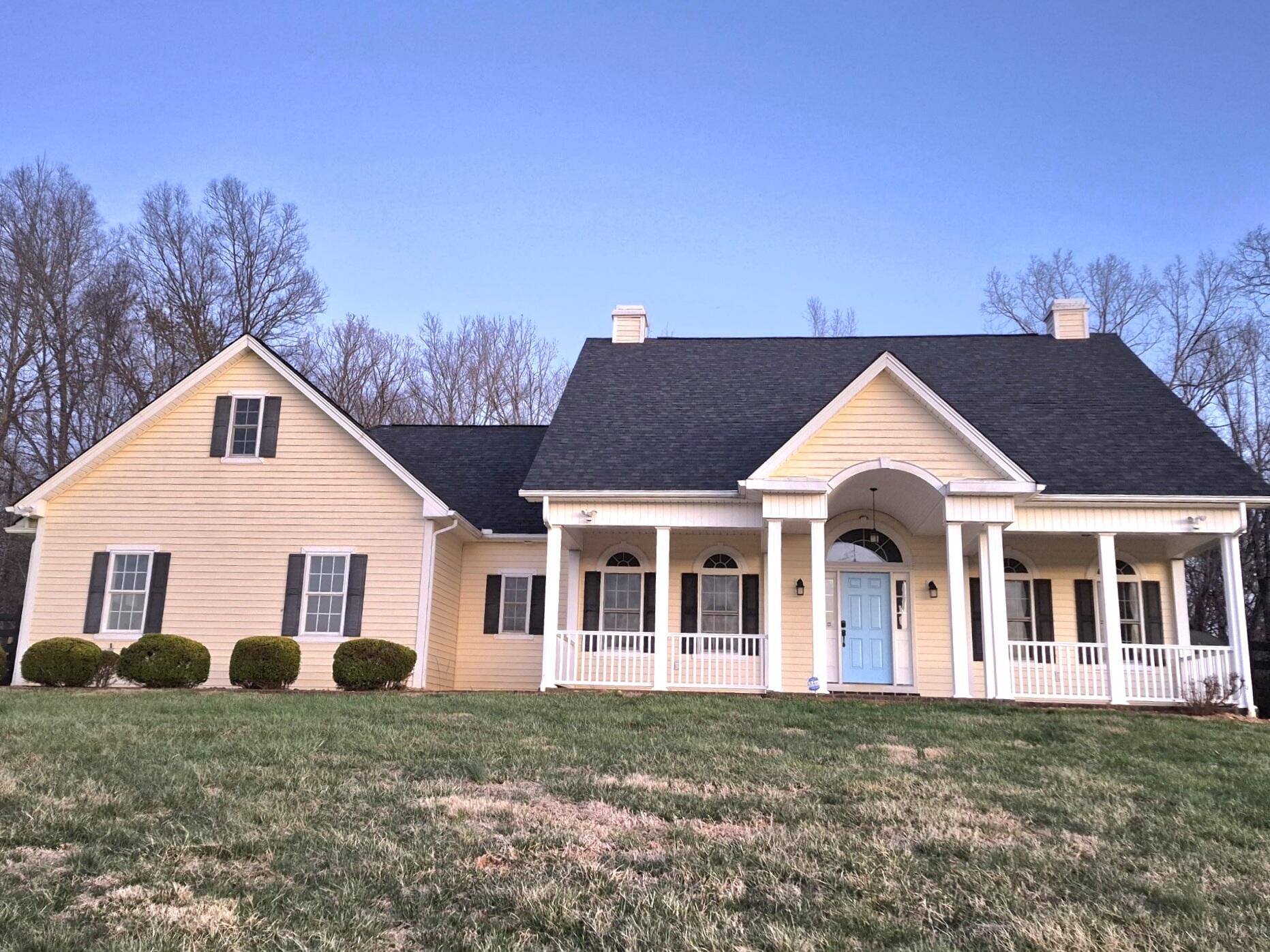 1627 Country Road Lynchburg, VA 24504 - Photo 1 of 1 a front view of a house with a garden