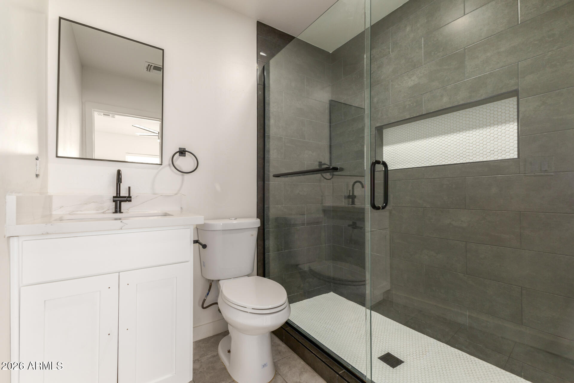 1912 West Roma Avenue Phoenix, AZ 85015 - Photo 12 of 25 a bathroom with a sink a toilet and shower