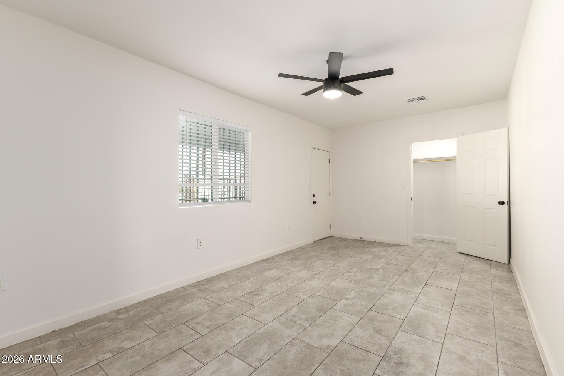 1912 West Roma Avenue Phoenix, AZ 85015 - Photo 14 of 25 an empty room with fan and windows