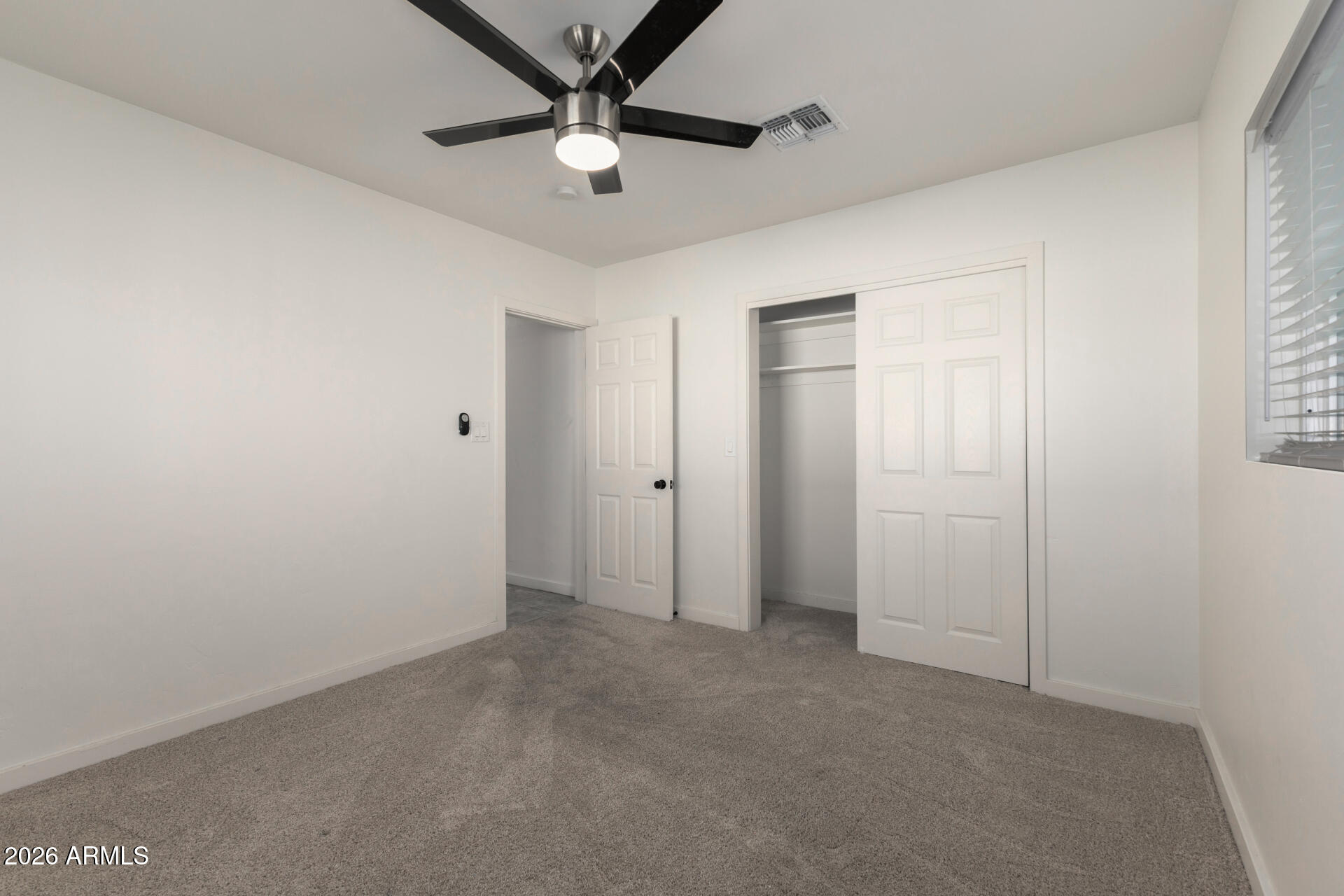 1912 West Roma Avenue Phoenix, AZ 85015 - Photo 17 of 25 an empty room with fan