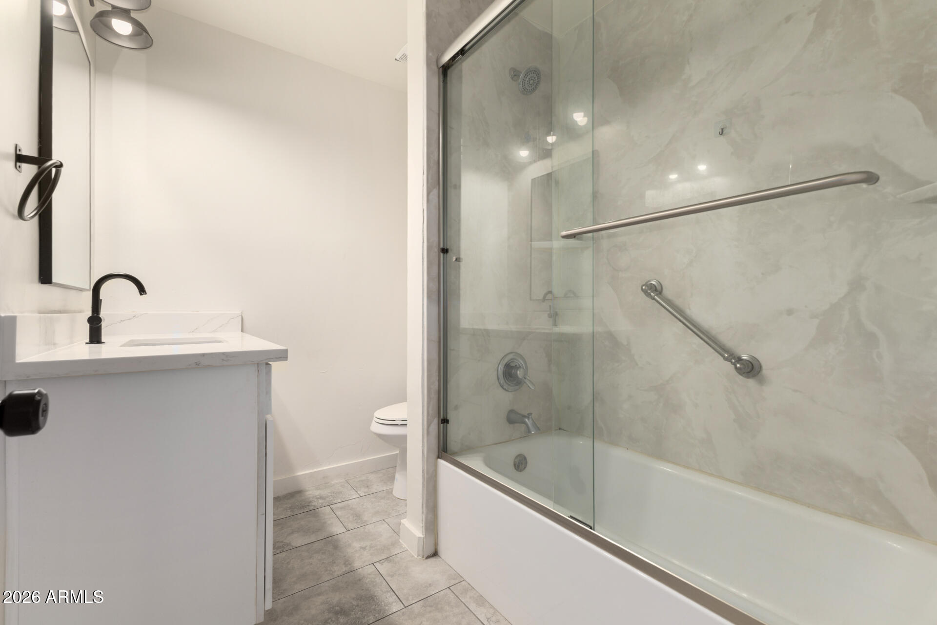 1912 West Roma Avenue Phoenix, AZ 85015 - Photo 18 of 25 a bathroom with a tub sink shower and mirror