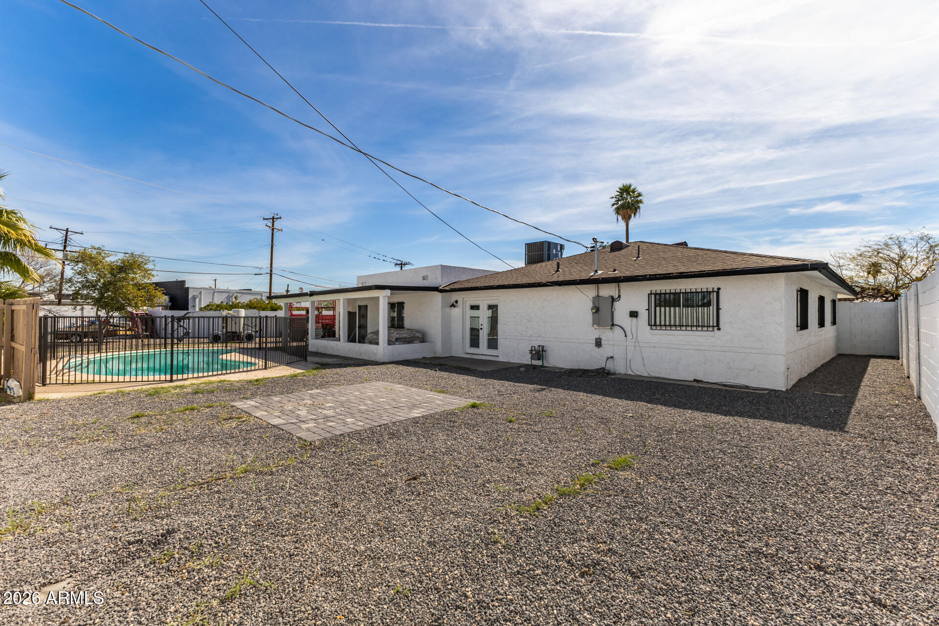1912 West Roma Avenue Phoenix, AZ 85015 - Photo 21 of 25 a front view of a house with a yard and garage