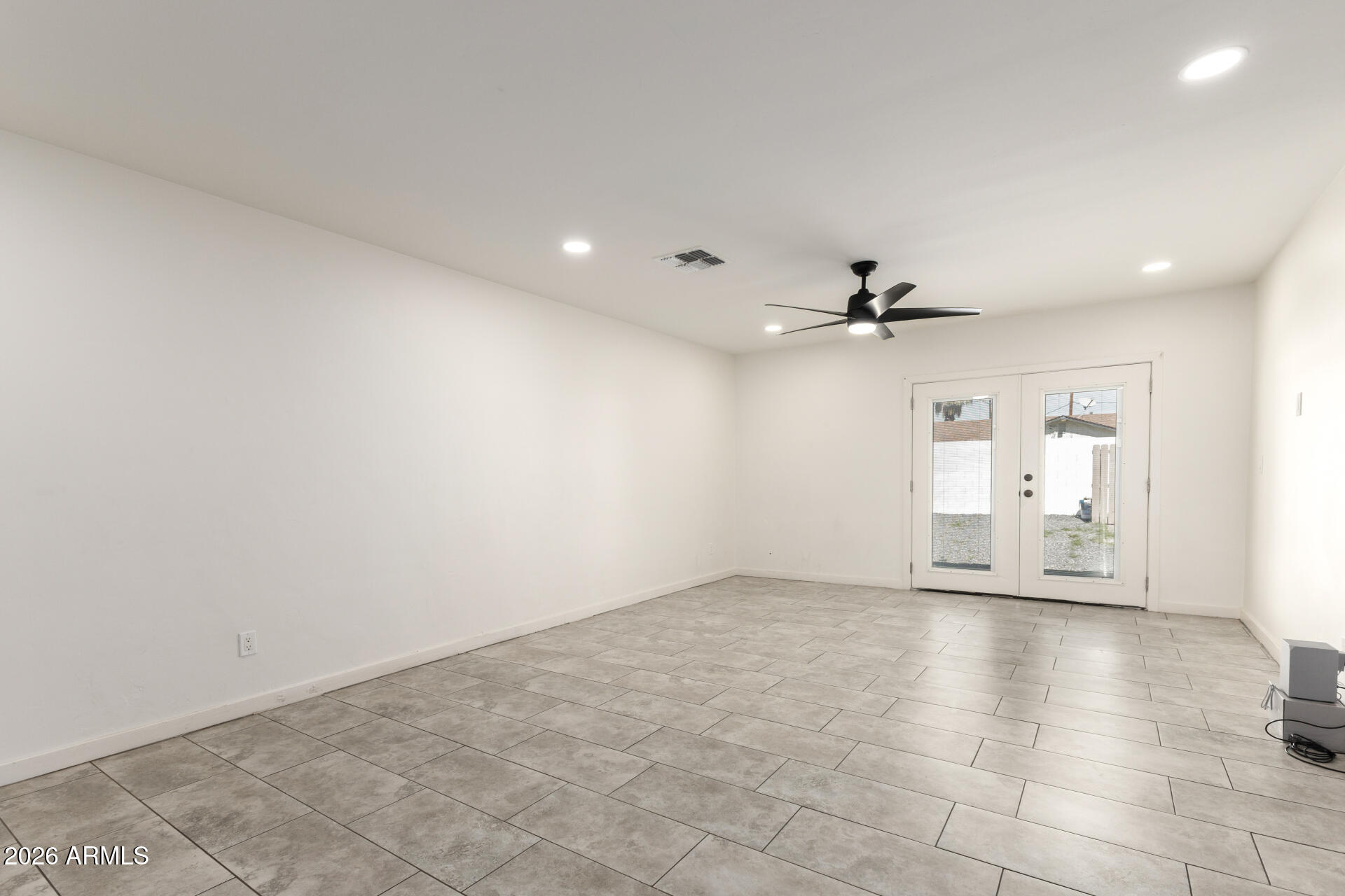 1912 West Roma Avenue Phoenix, AZ 85015 - Photo 4 of 25 wooden floor in an empty room with a window