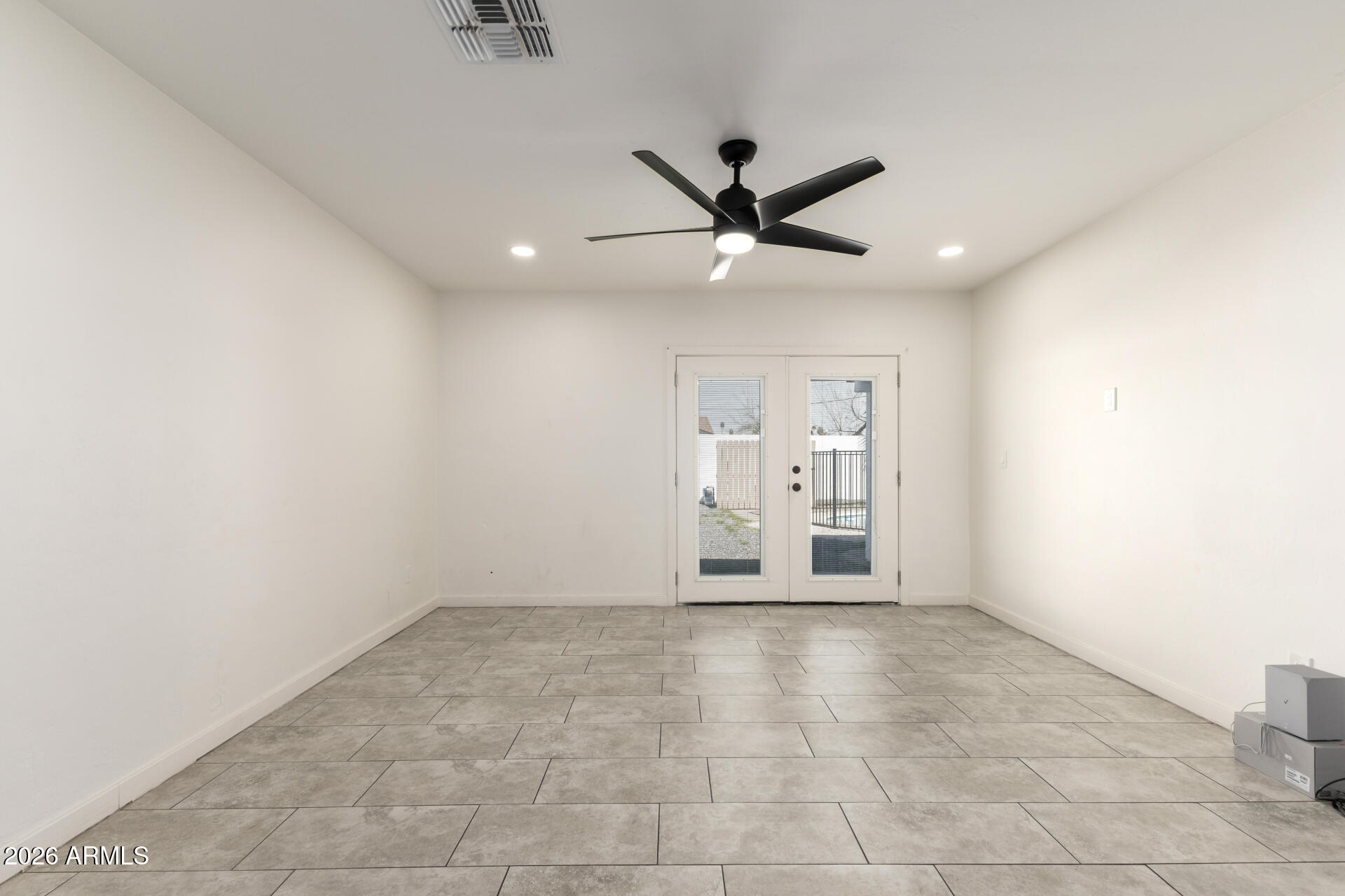 1912 West Roma Avenue Phoenix, AZ 85015 - Photo 5 of 25 a view of an empty room with a window