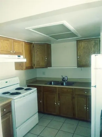 a kitchen with a sink and cabinets