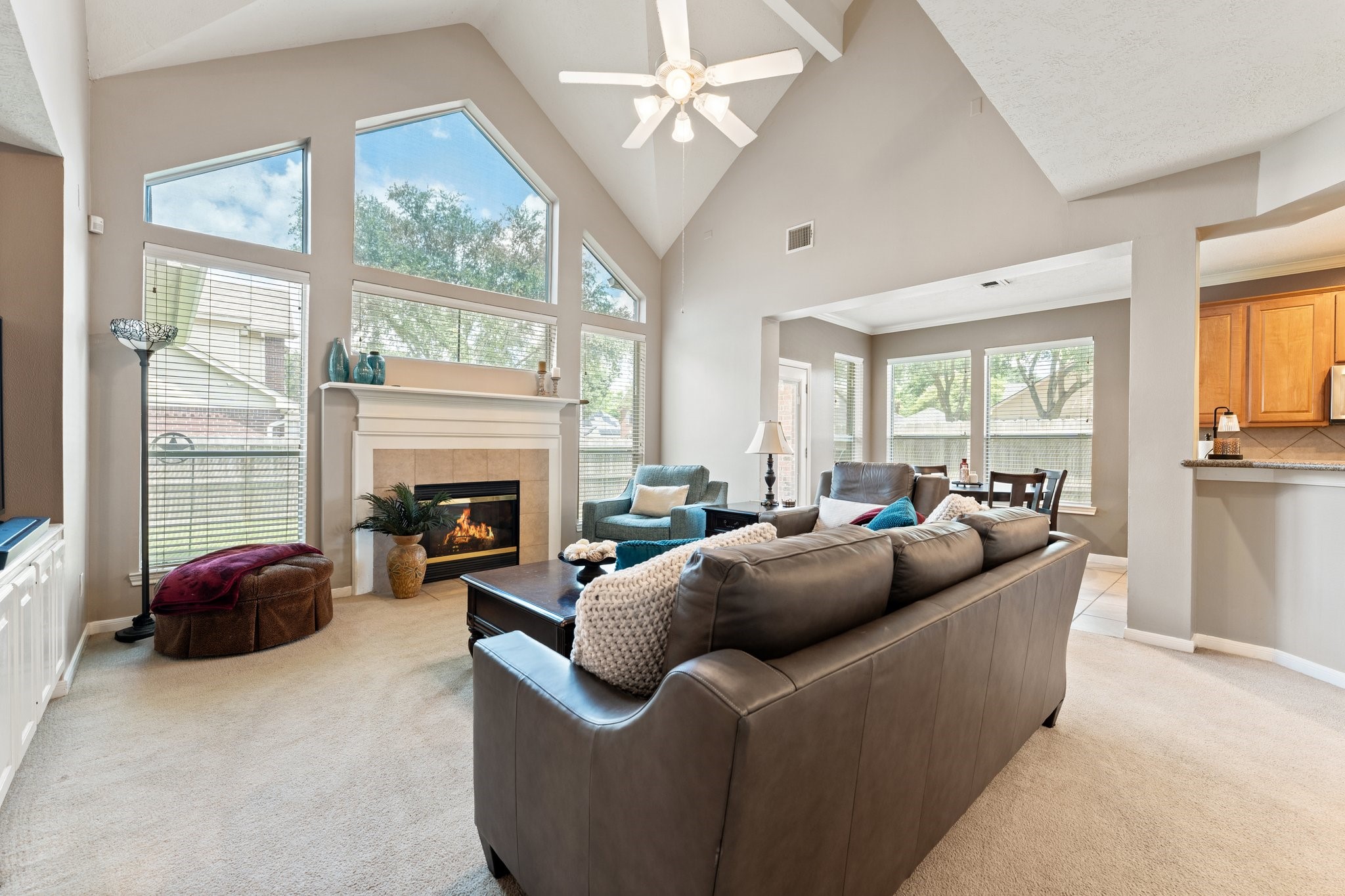 25447 China Springs Spring, TX 77373 - Photo 16 of 45 A comfortable living room centered around a warm fireplace, perfect for movie nights, holidays, and relaxation.