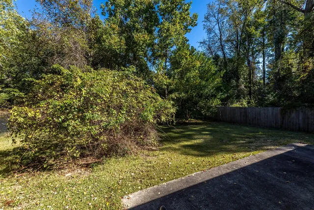 a view of a backyard of the house