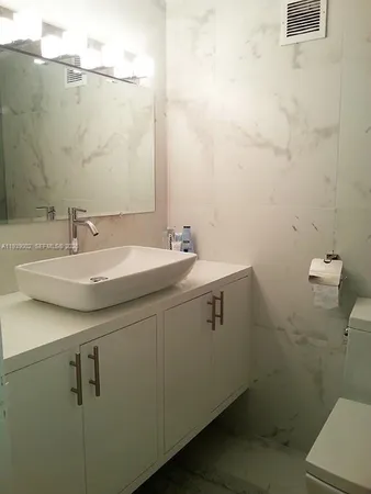 a bathroom with a sink and a toilet