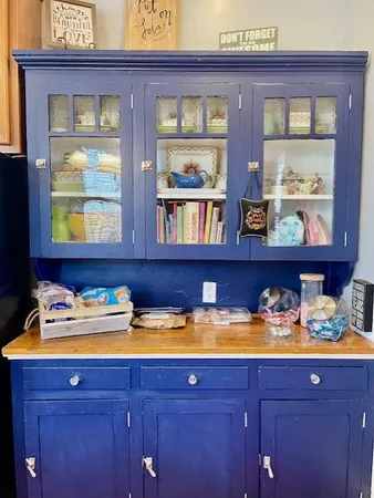 a bathroom with a sink vanity and a large mirror