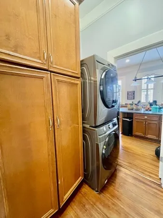 a kitchen with stainless steel appliances granite countertop a refrigerator and a stove