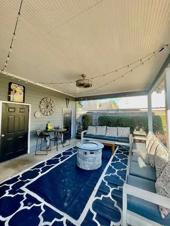 a living room with furniture a rug and a floor