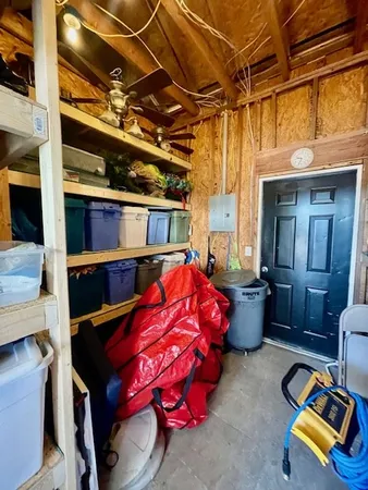 a bed room with a bed and a chair