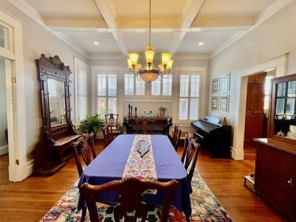 a view of a dining room with furniture and window