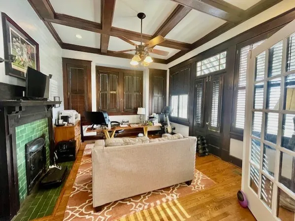 a living room with fireplace furniture and a flat screen tv