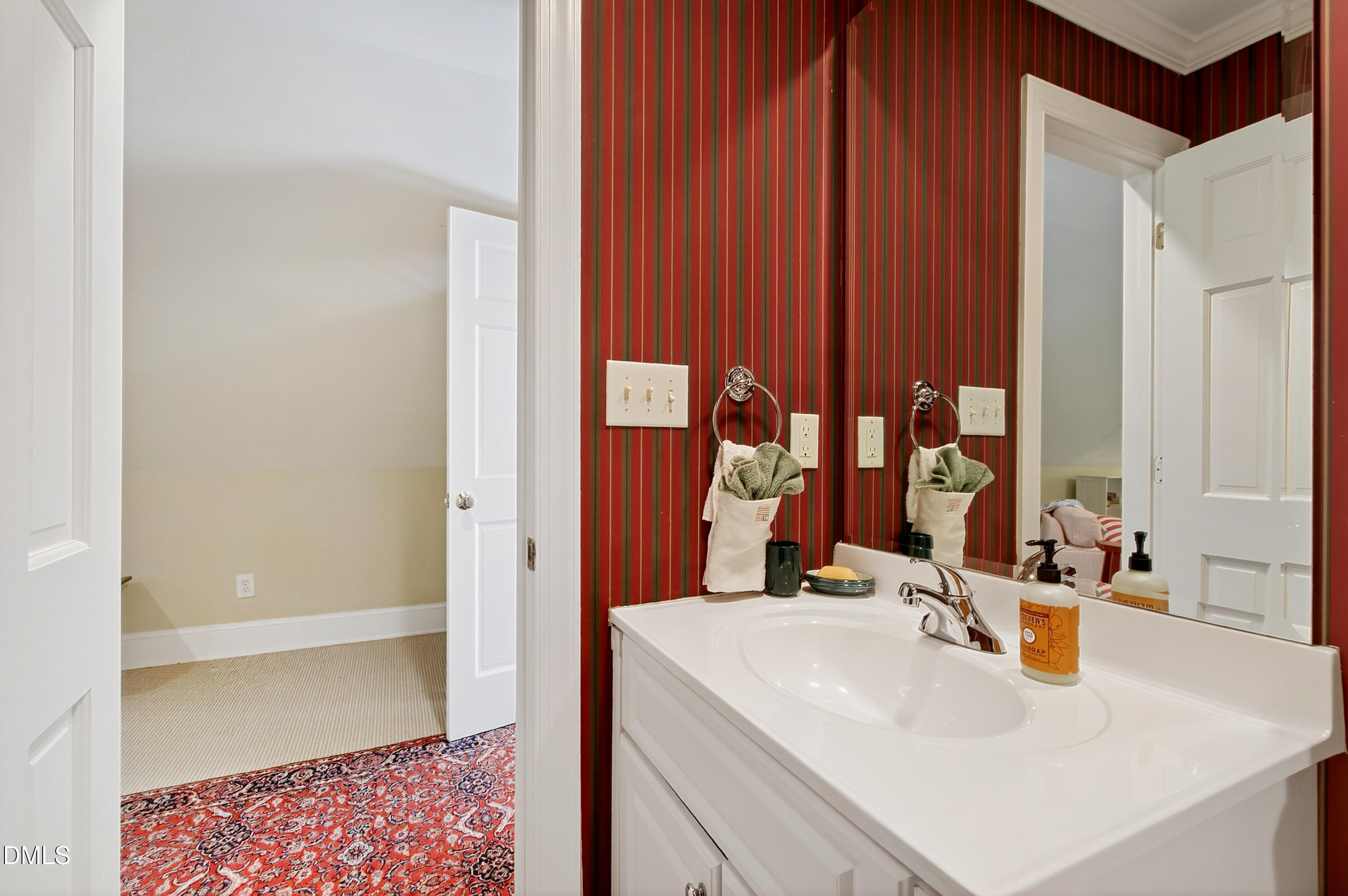 3708 Lubbock Drive Raleigh, NC 27612 - Photo 51 of 64 a bathroom with a sink and a mirror