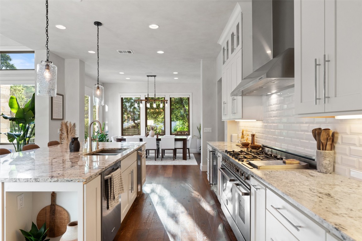 1002 Meriden Lane Austin, TX 78703 - Photo 11 of 35 a kitchen with sink stove and cabinets