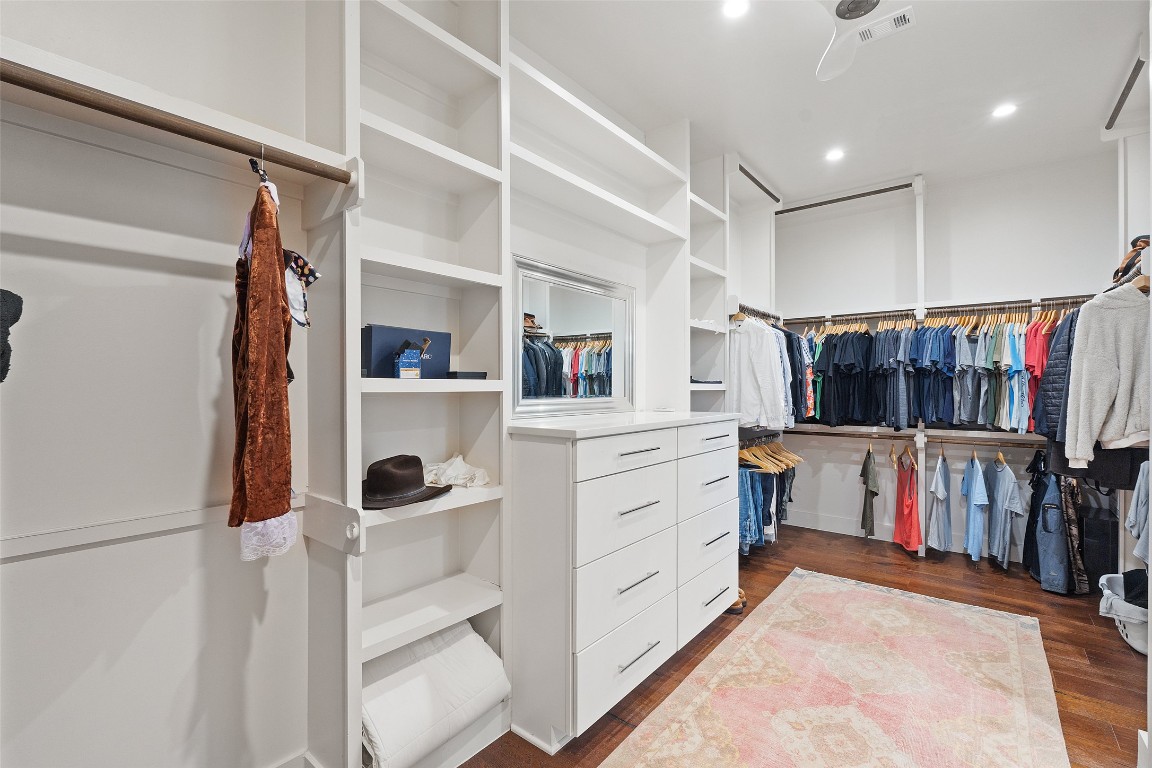 1002 Meriden Lane Austin, TX 78703 - Photo 22 of 35 a view of walk in closet with clothes and shoes