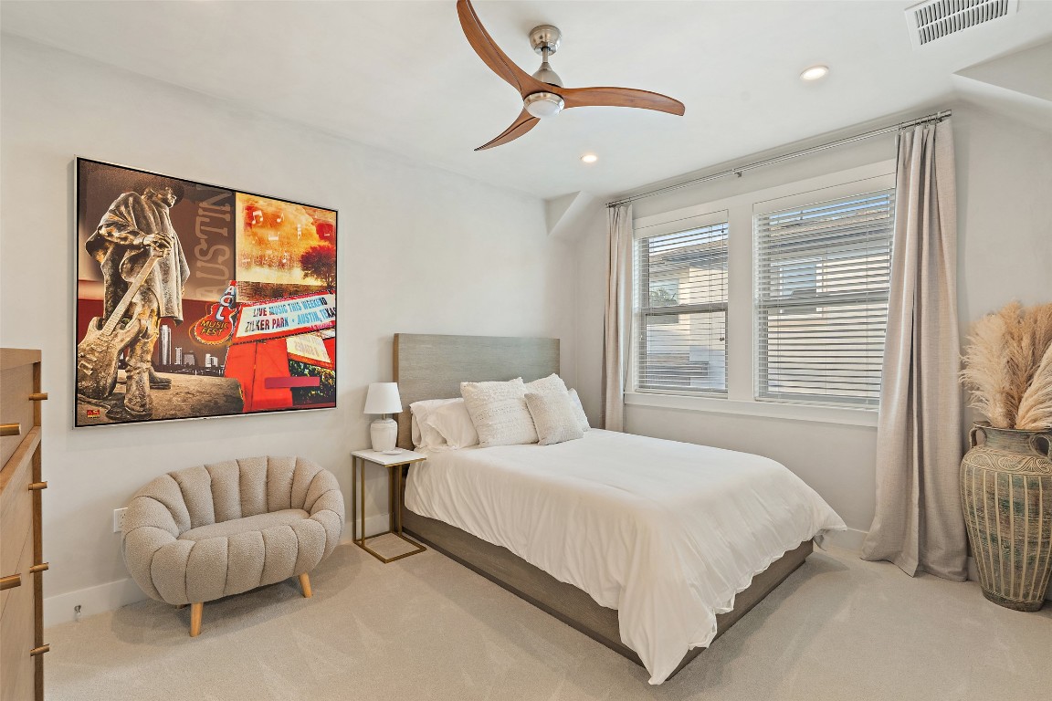 1002 Meriden Lane Austin, TX 78703 - Photo 28 of 35 a bedroom with a bed and a couch