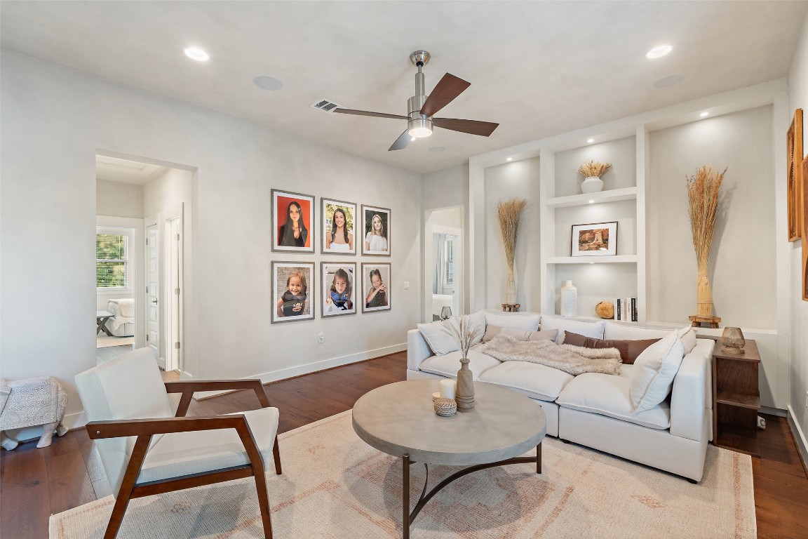 1002 Meriden Lane Austin, TX 78703 - Photo 30 of 35 a living room with furniture and a wooden floor