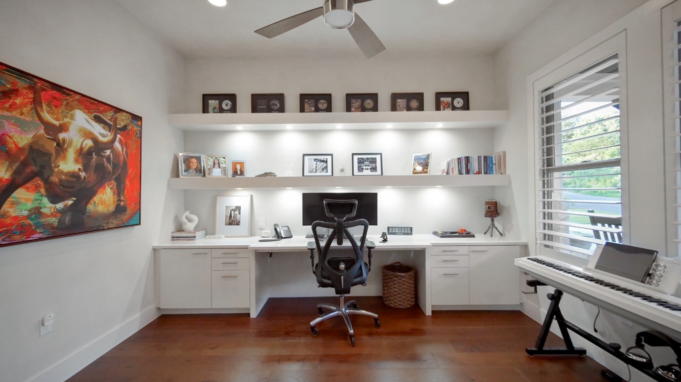 1002 Meriden Lane Austin, TX 78703 - Photo 32 of 35 a view of workspace with wooden floor and a window