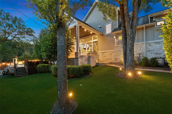 a view of a back yard of the house with green space