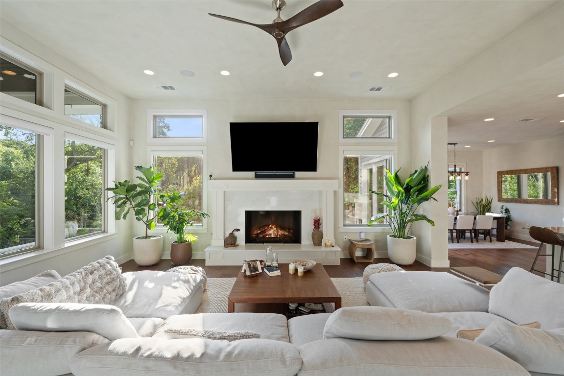 1002 Meriden Lane Austin, TX 78703 - Photo 7 of 35 a living room with furniture a fireplace and a flat screen tv