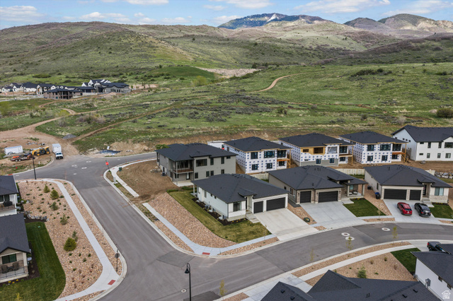 3349 Oxford Loop Morgan, UT 84050 - Photo 40 of 47 Aerial view of residential area featuring a mountainous background