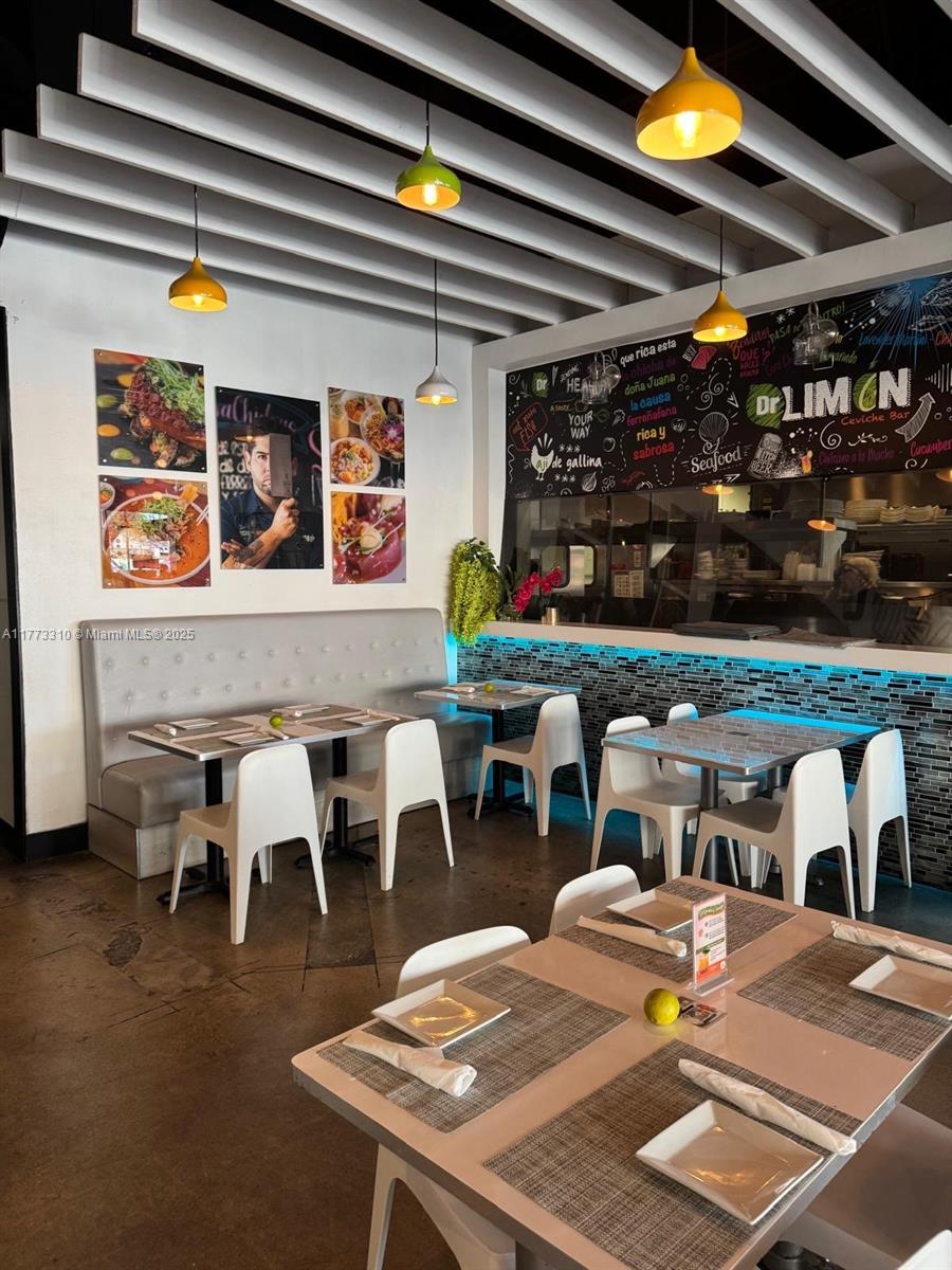 9459 South Dixie Highway Miami, FL 33156 - Photo 8 of 11 a view of a dining table and chairs in the patio