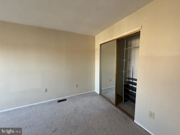 an empty room with closet