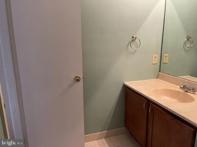 a bathroom with a sink and mirror