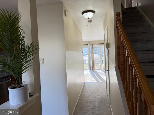 27 Stratton Court Robbinsville, NJ 08691 - Photo 10 of 28 a view of a hallway to a livingroom with furniture and entryway