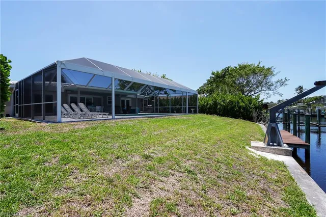 a view of a house with a yard patio and slide