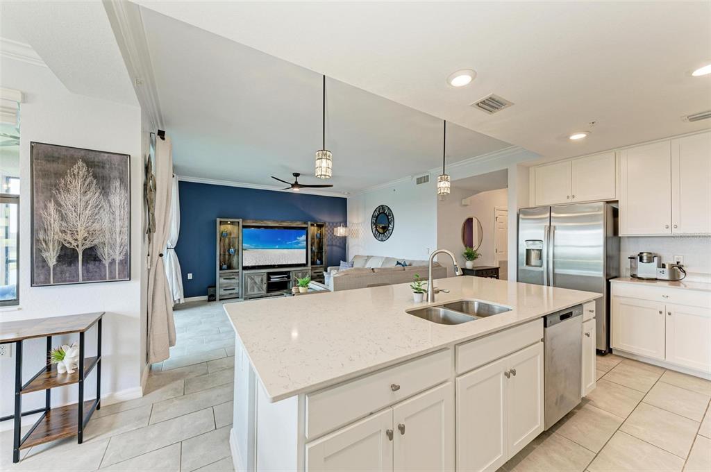 17902 Gawthrop Drive, Unit 307 Lakewood Ranch, FL 34211 - Photo 18 of 74 a kitchen with stainless steel appliances granite countertop a sink refrigerator and cabinets