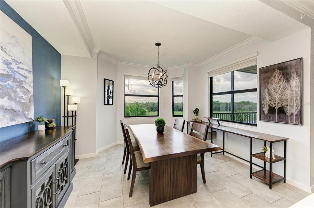 17902 Gawthrop Drive, Unit 307 Lakewood Ranch, FL 34211 - Photo 21 of 74 a view of a dining room with furniture window and outside view